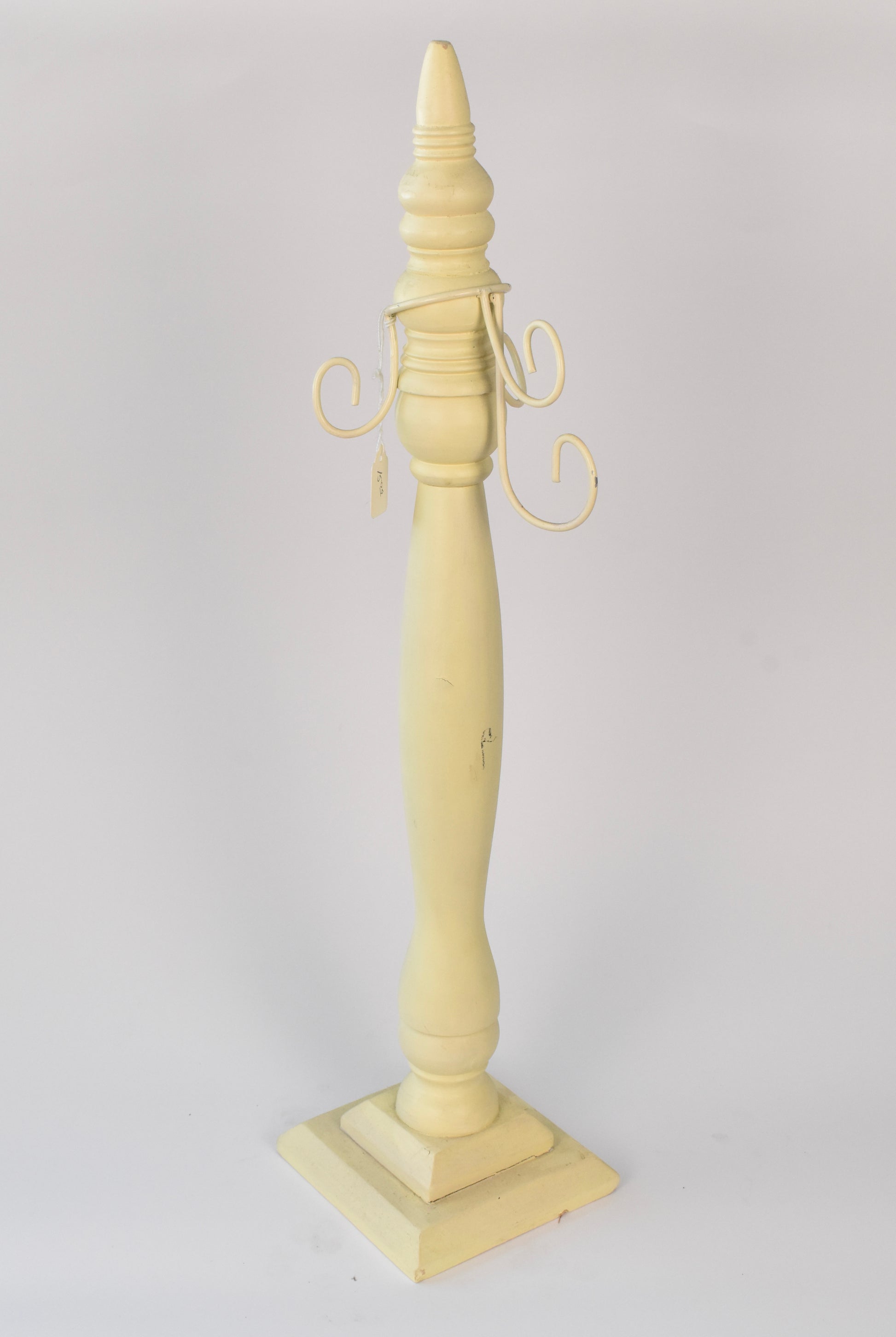 Vintage-Inspired Pale Yellow Taper Holder with Scroll Arms